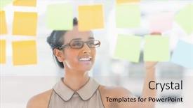  Presentation with sticky notes - Audience pleasing PPT theme consisting of young smiling designer looking at sticky notes on window in creative office backdrop and a soft green colored foreground