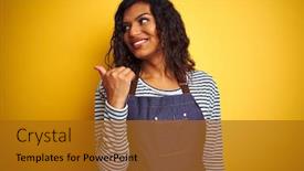  Presentation with transgender - Beautiful presentation theme featuring young transsexual transgender chef woman wearing apron over isolated yellow background smiling with happy face looking and pointing to the side with thumb up backdrop and a gold colored foreground