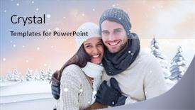  Presentation with winter - PPT theme consisting of young winter couple against snowy landscape with fir trees background and a light blue colored foreground