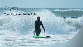  Presentation with ocean waves - Audience pleasing PPT theme consisting of young woman in black wetsuit holds surfboard and walks into the furious ocean with huge waves backdrop and a light blue colored foreground