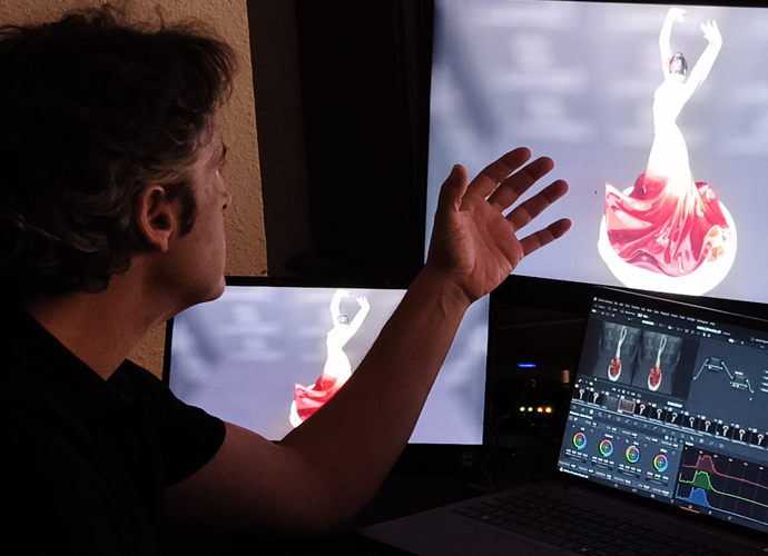 man in front of display screens