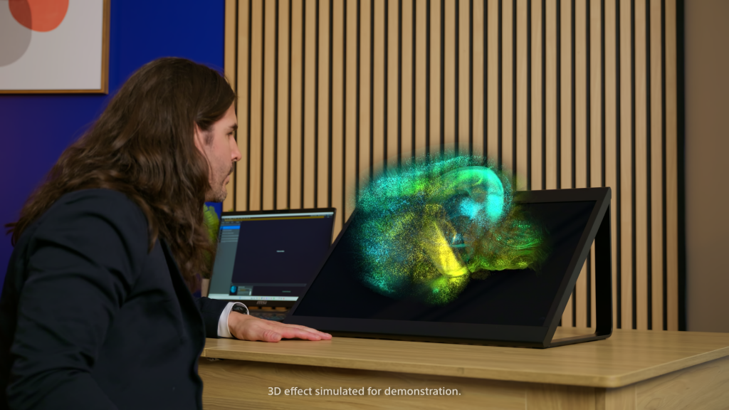 man in front of screen with 3d content popping out