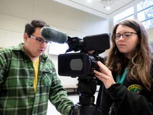 students capturing content on camera