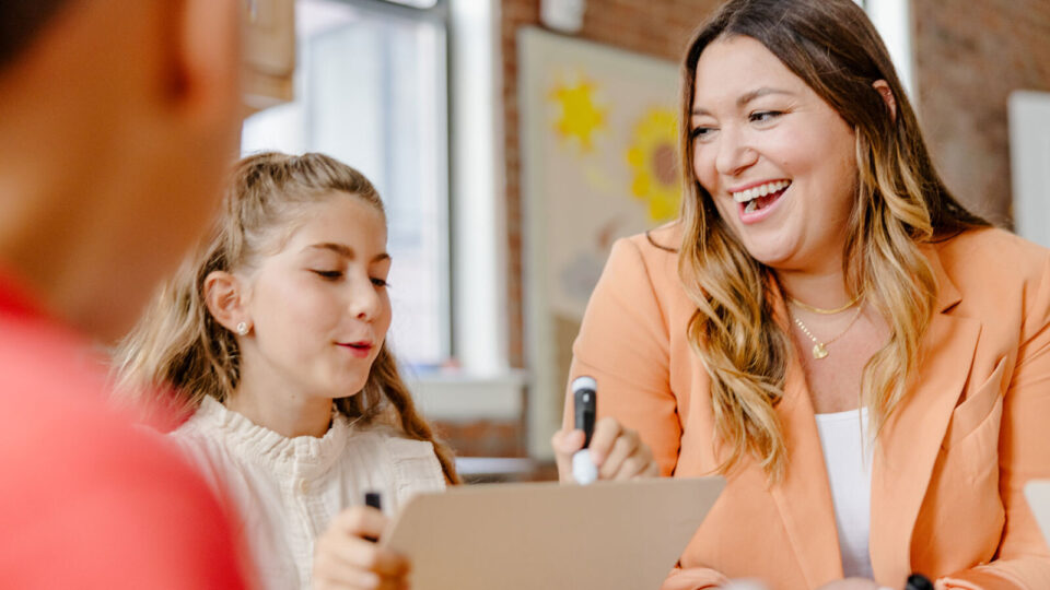 Teacher connects with a student during a lesson
