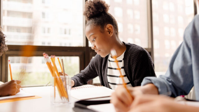 Student writing during class 