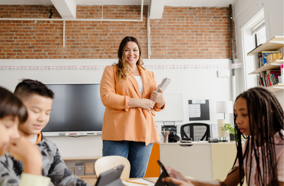 Teacher standing in front their class WF2379900
