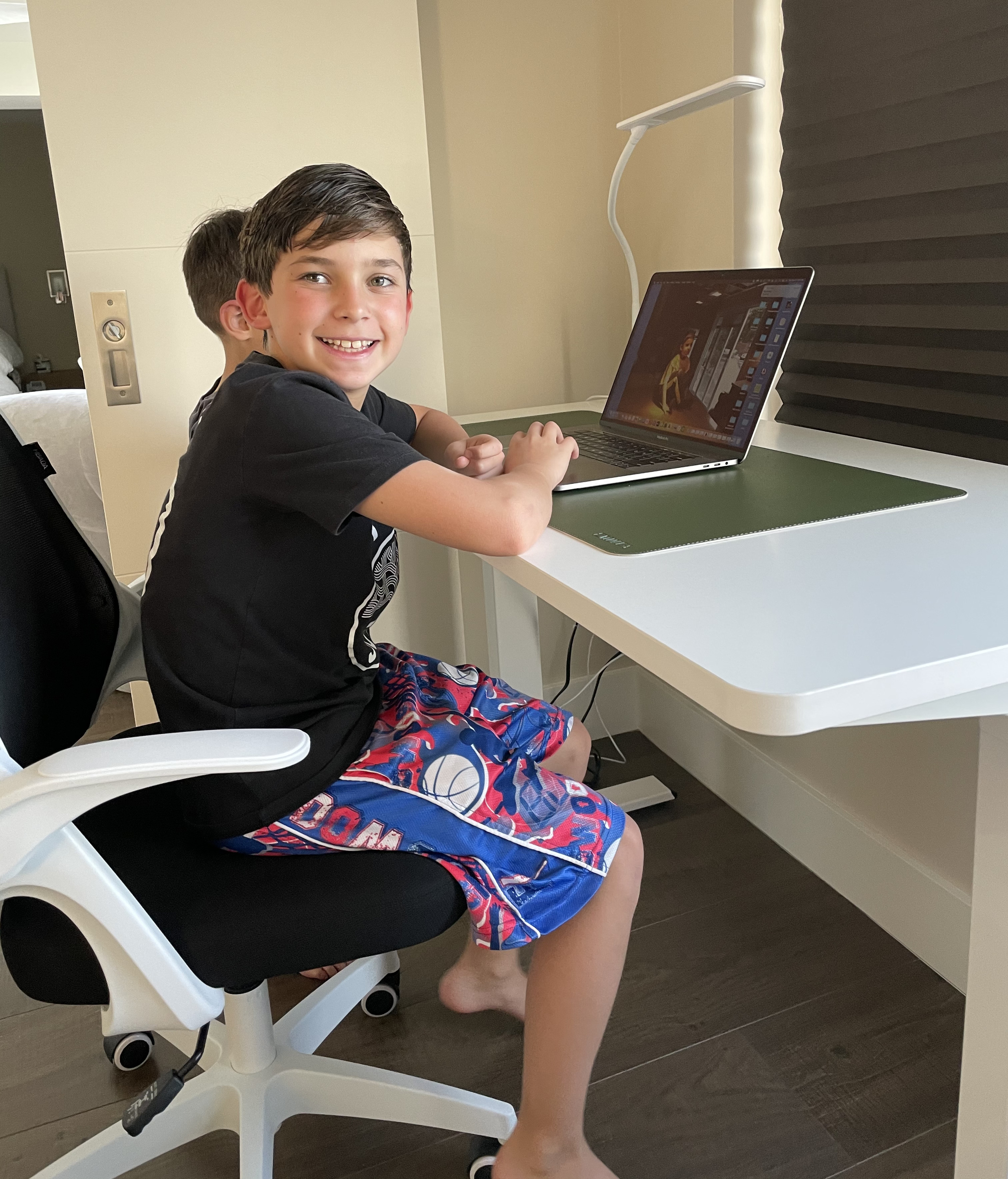 Happy student at Sit Stand desk