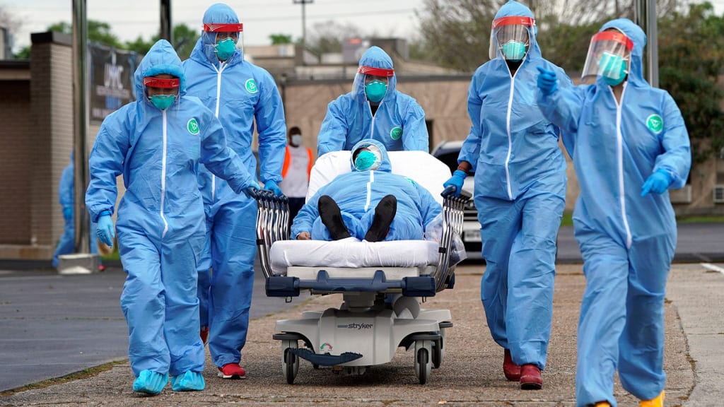 Un médico pasa por el "en una camilla, empujado por el personal médico, posiblemente agonizando o saludando desde la otra vida", escribió un galeno. 