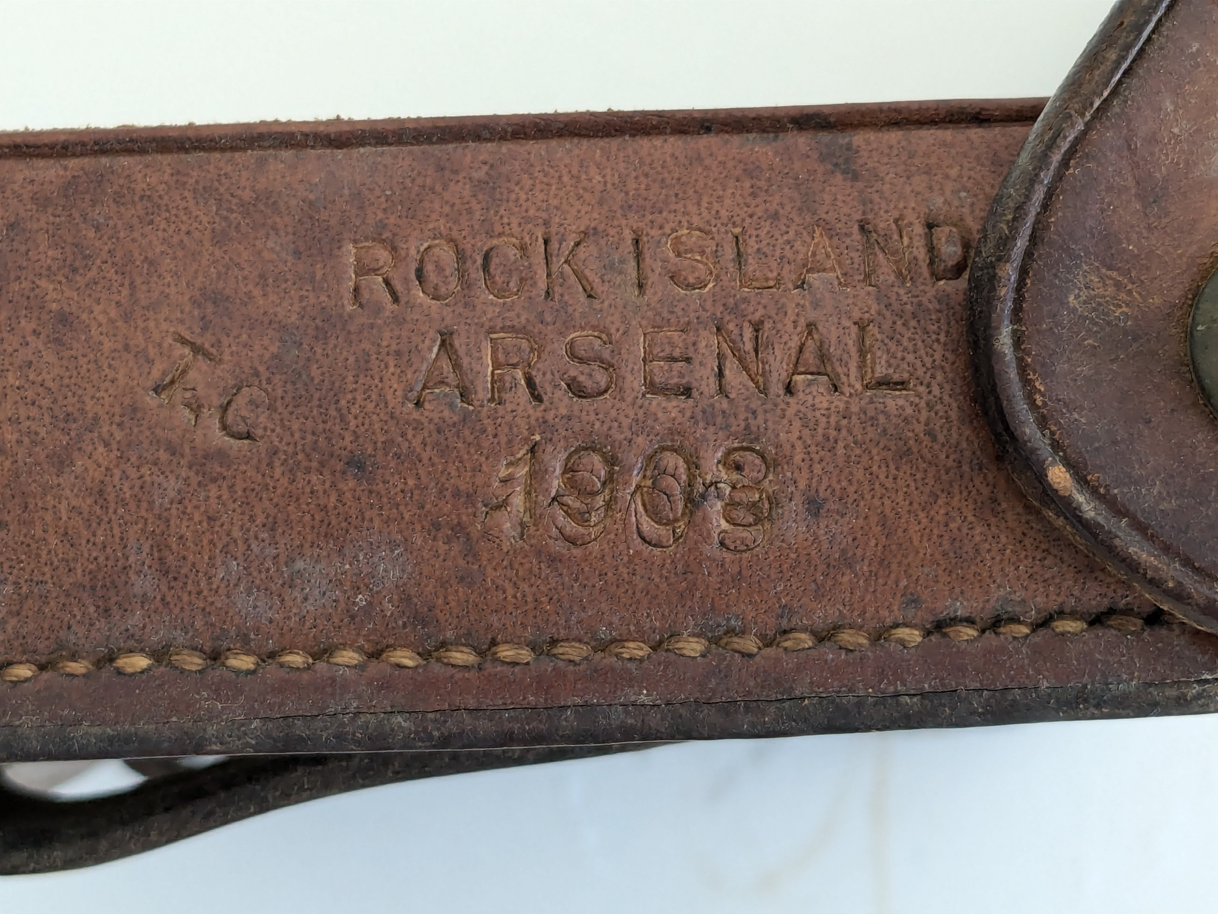 Maker stamp reading ROCK ISLAND ARSENAL 1903 on the back of a McKeever cartridge box