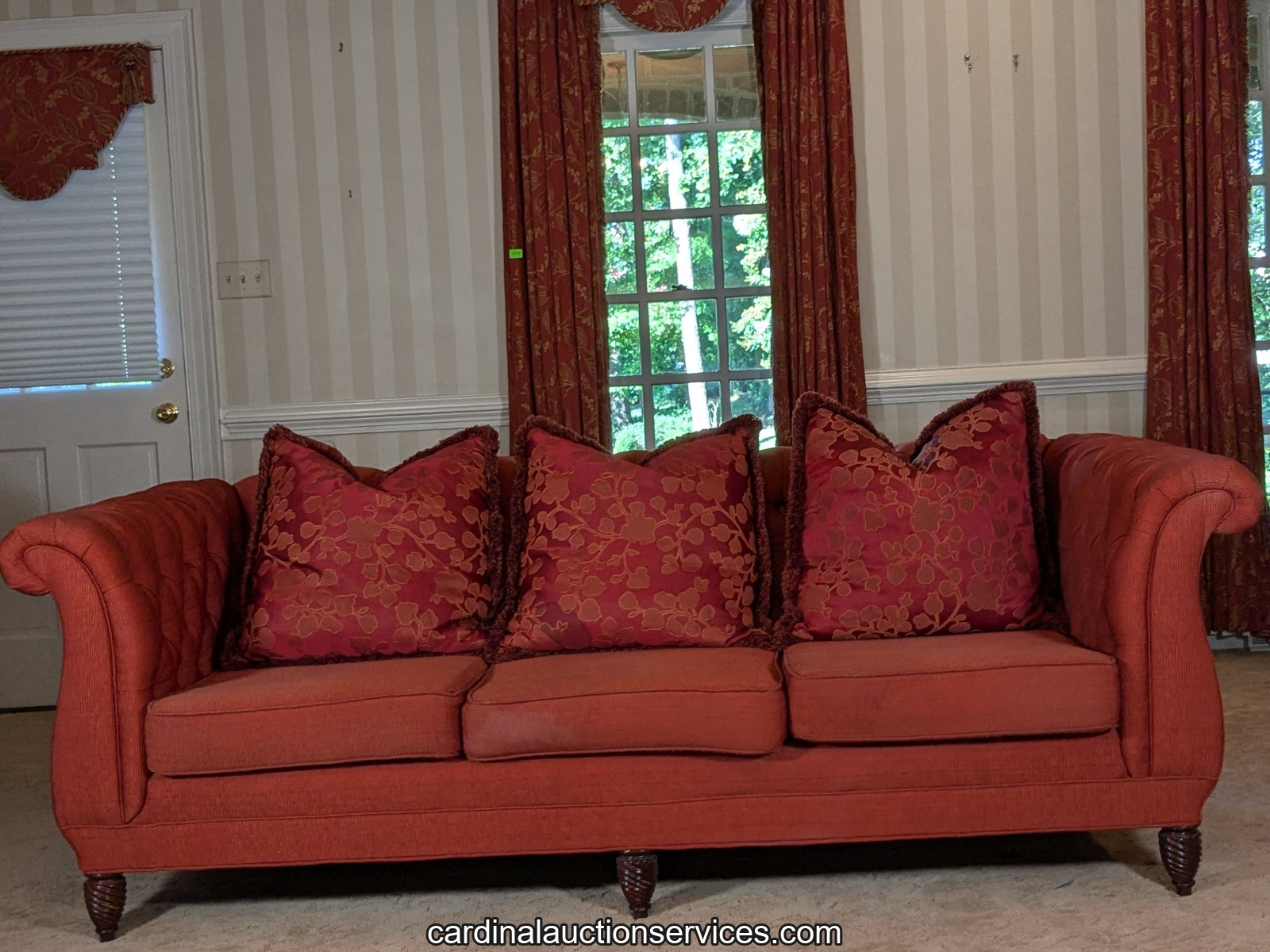 Red button-tufted Chesterfield sofa, Lot 201, Barrington estate sale