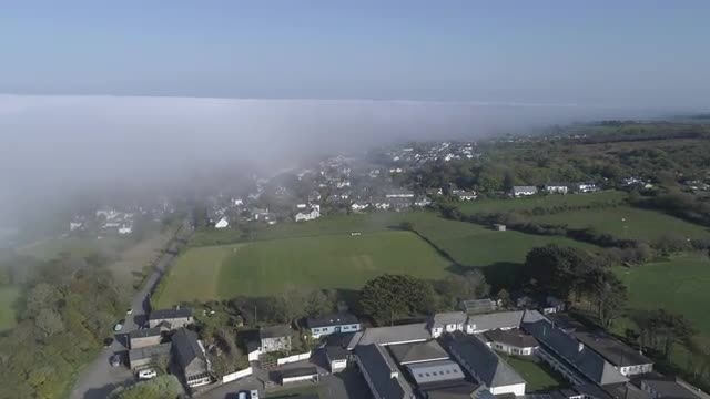 Aerial View Of Fog Mist Over Rural Countryside in Cornwall, England, UK 4K