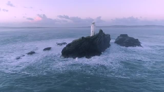 Aerial view of Godrevy Lighthouse at sunrise. Cornwall, England, UK