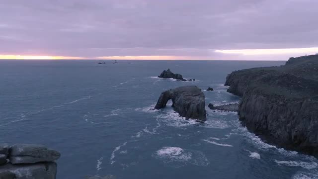 Land's End Sunset on a moody evening in Cornwall, UK 