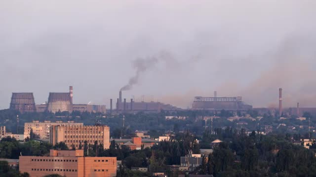 Pollution, Smoke From An Industrial Chimney, Above A Town
