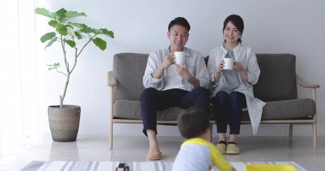 Japanese family having fun in the living room