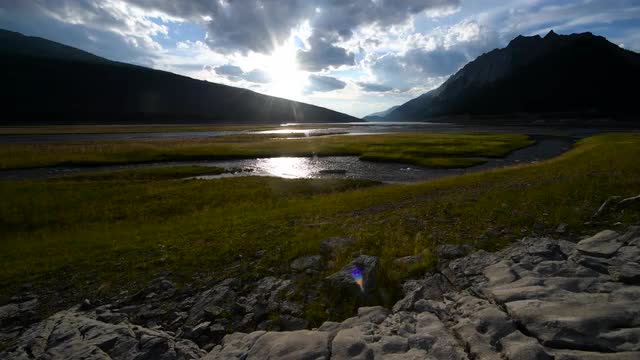 Stream flowing into Medicine Lake on a cloudy summer evening