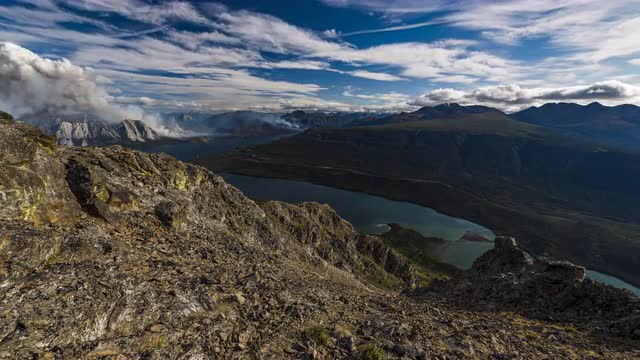 Time lapse smokey wildfire burning in Yukon near Carcross from mountain peak 