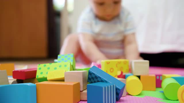 Cute Baby Playing on the Floor at Home