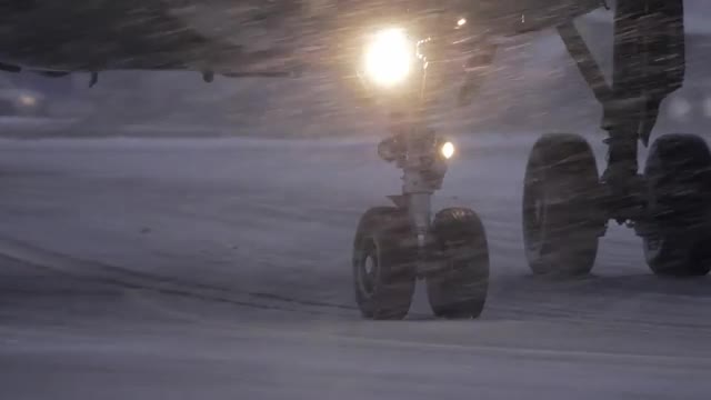Plane wheels on runaway in heavy snowfall