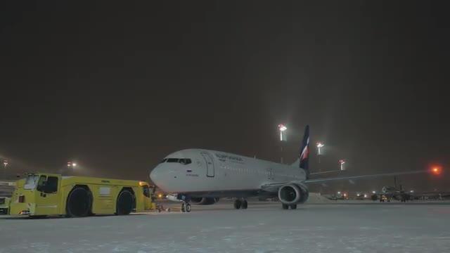 Aeroflot Boeing 737-800 pushback at winter night. Sheremetyevo Airport in Moscow