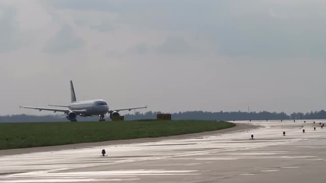 Airliner moves on runway. Takeoff run of passenger airplane