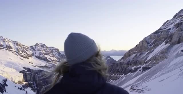 A Woman Looking Over a Mountain Valley in Banff