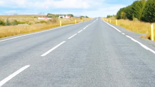 Slow motion point of view car driving on golden circle in Southern Iceland 