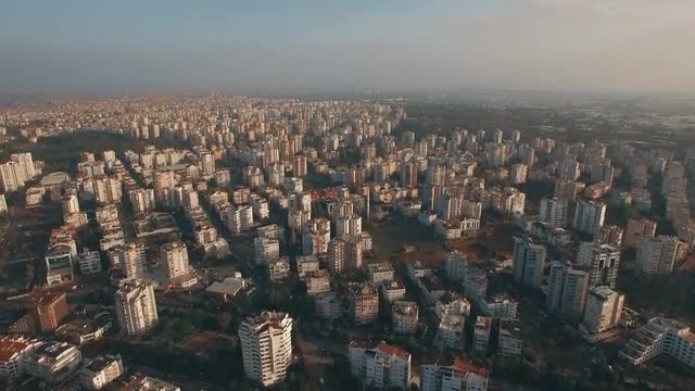 Flying over residential areas built-up with houses in Antalya, Turkey