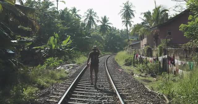 Traveler goes on rail tracks
