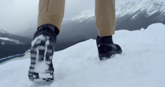 Man walking through snow