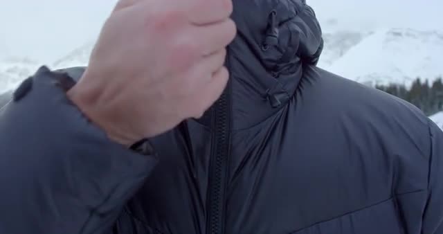 Man zipping up his coat