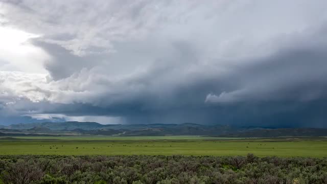 Time lapse of storm with dramatic clouds over landscape