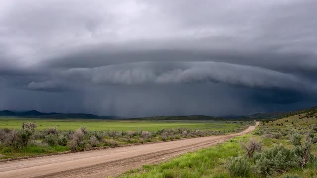 Time lapse of shelf cloud storm moving over the landscape