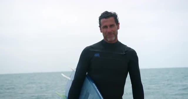 Man holding surfboard