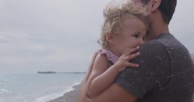 Parents with daughter on beach