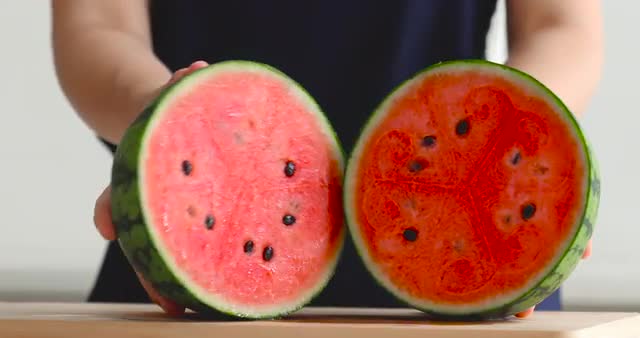 Japanese woman cutting watermelon