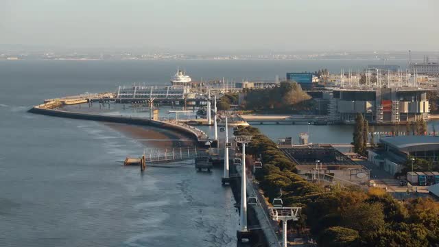 Timelapse of cable car traffic over Lisbon waterfront, Portugal