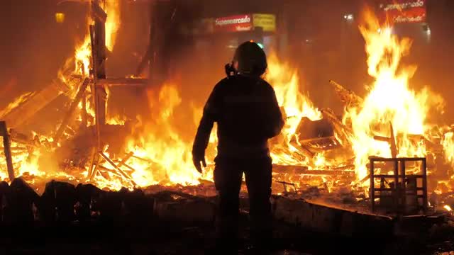 Firefighter on La Crema during Fallas in Valencia, Spain