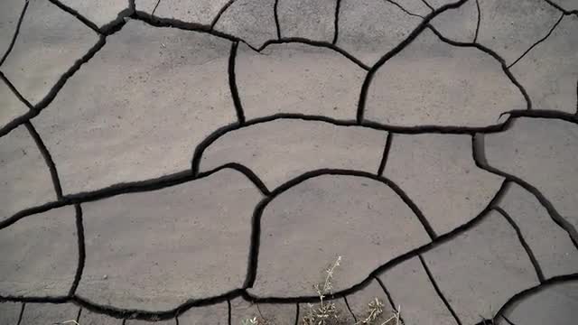 Panning over deep cracks in the mud