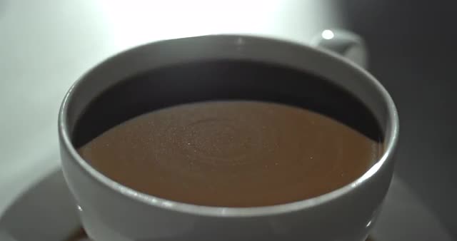 Slow Motion Coffee Cup Swirl Stationary