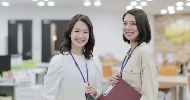 Japanese businesswomen working happily in the office