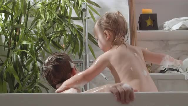 Children bathing in foamy water