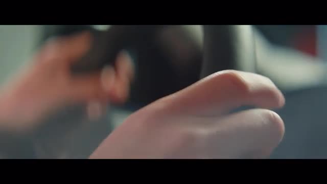 Close up shot of hands gripping a steering wheel
