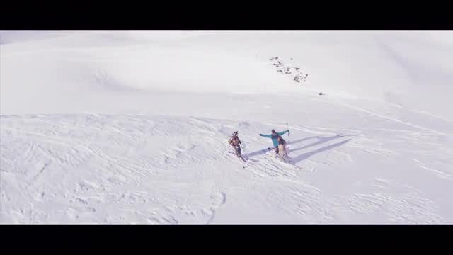 Skiers on a mountainside aerial
