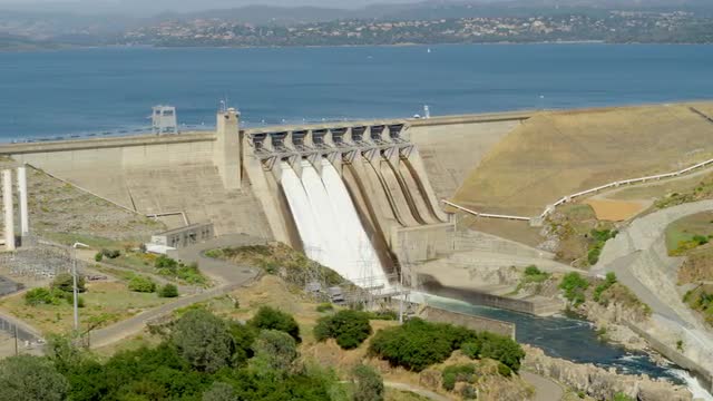Wide aerial trucking left to right shot of the Folsom Dam