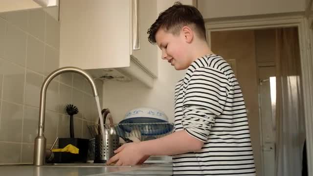 Boy washing hands
