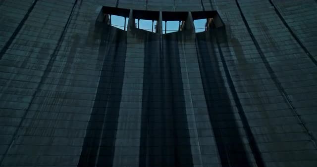 Long one take of tall hyrdroelectric dam, river, and reservoir