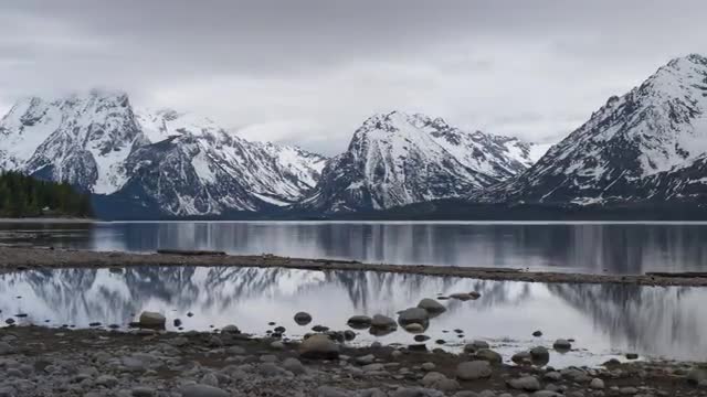 Timelapse - Overcast Teton Mountains Reflected in Lake