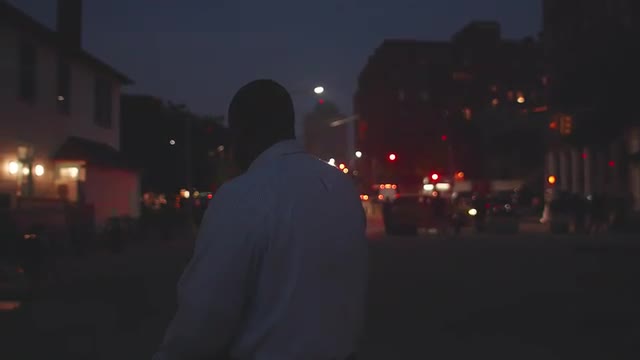 African American Male Watches Nightlife Go By