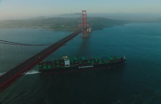 Wide aerial shot of golden gate bridge at sunrise